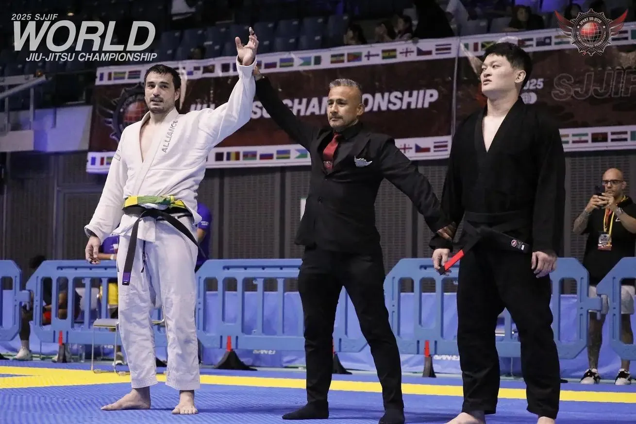 The referee raising Spiro Kovac's hand at the 2025 SJJIF World Jiu-Jitsu Championship